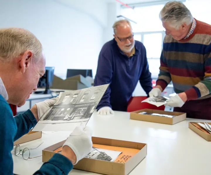 volunteers-viewing-photo-boxes