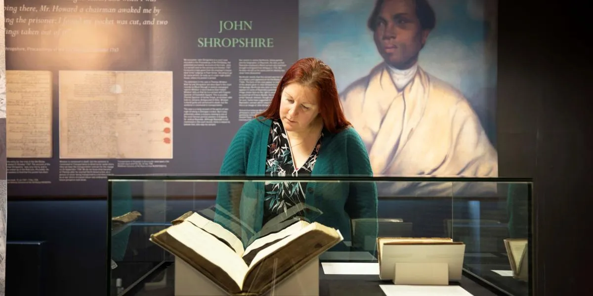 woman-viewing-unforgotten-lives-exhibition
