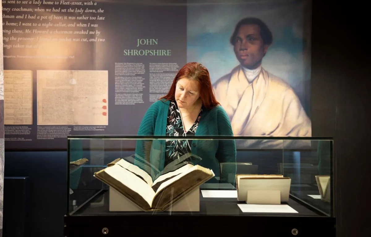 woman-viewing-unforgotten-lives-exhibition